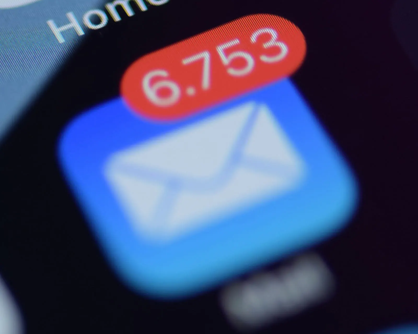 A phone's mail app icon showing 6,753 unread emails